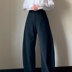 toteme style high waist curved wide leg trousers